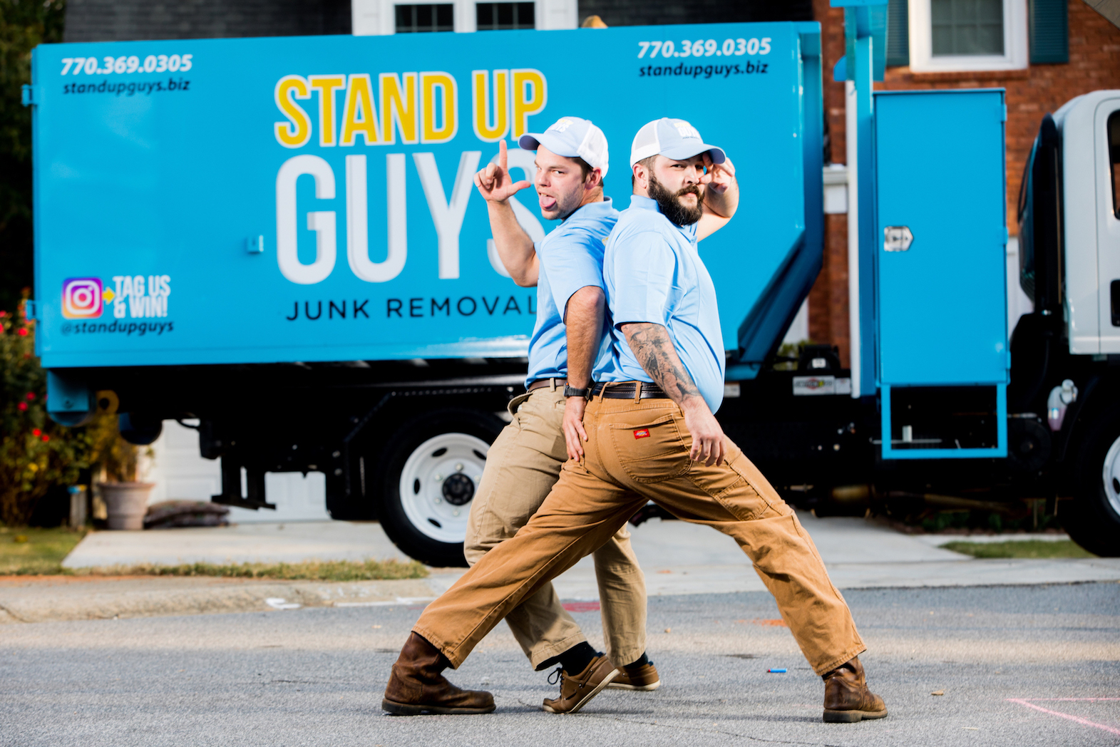 two stand up guys in front of junk removal truck in morrisville north carolina