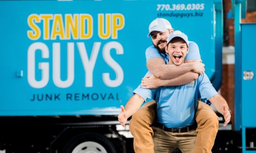 stand up guys junk removal crew in front of their junk truck in arlington texas