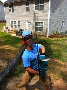 stand up guy holding a chainsaw 