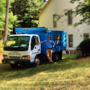 carson standing next to the junk removal truck