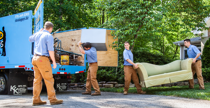 Stand Up Guys Loading Up The Junk Truck