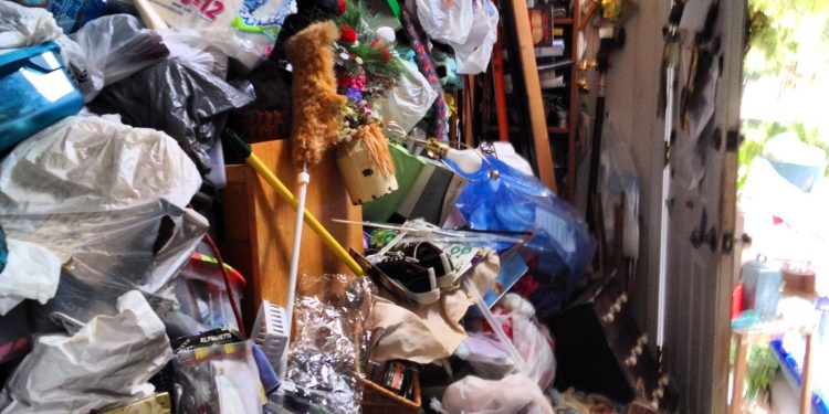 living room filled with junk in johns creek